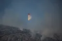 Greece battles to contain massive wildfire as burned area grows