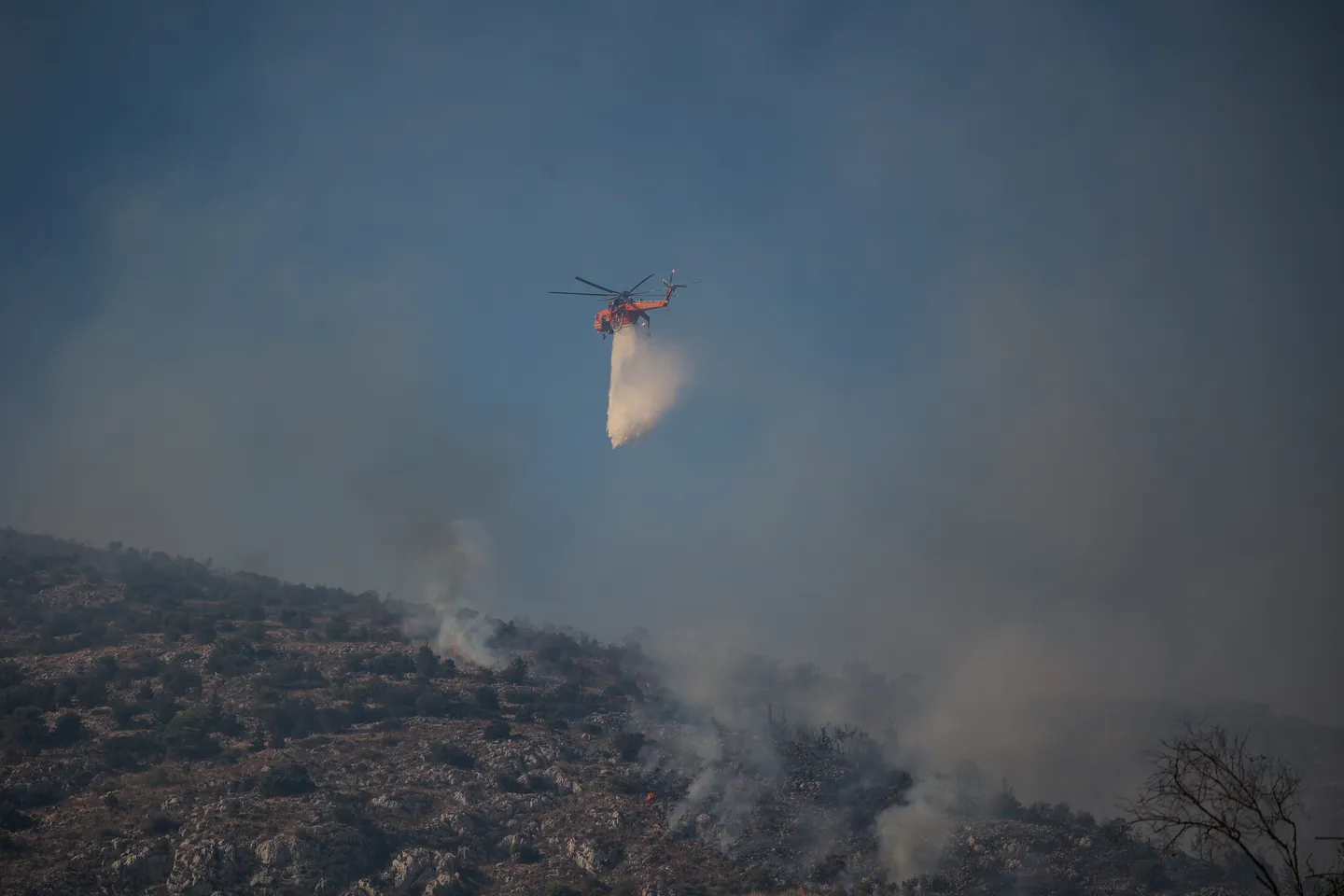 Greece battles to contain massive wildfire as burned area grows