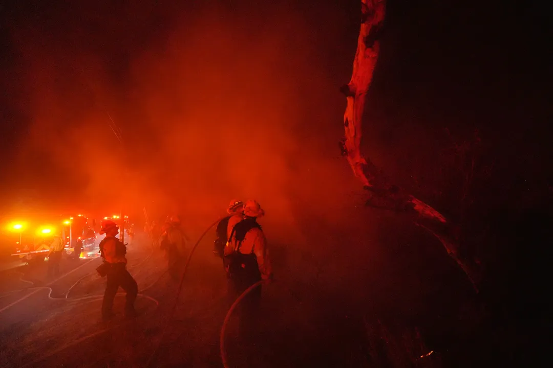 Fast-growing wildfires engulf multi-million dollar homes in California