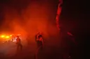 Fast-growing wildfires engulf multi-million dollar homes in California