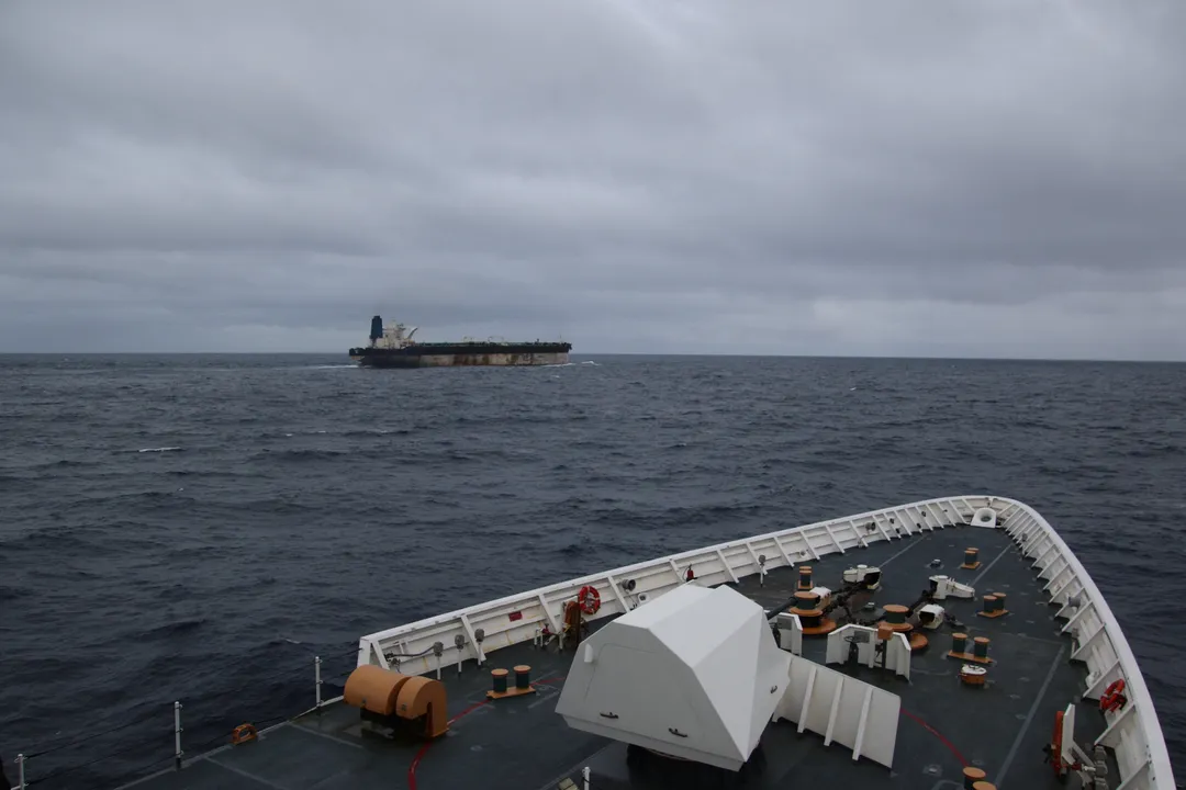 Why do oil tankers sail under foreign flags?