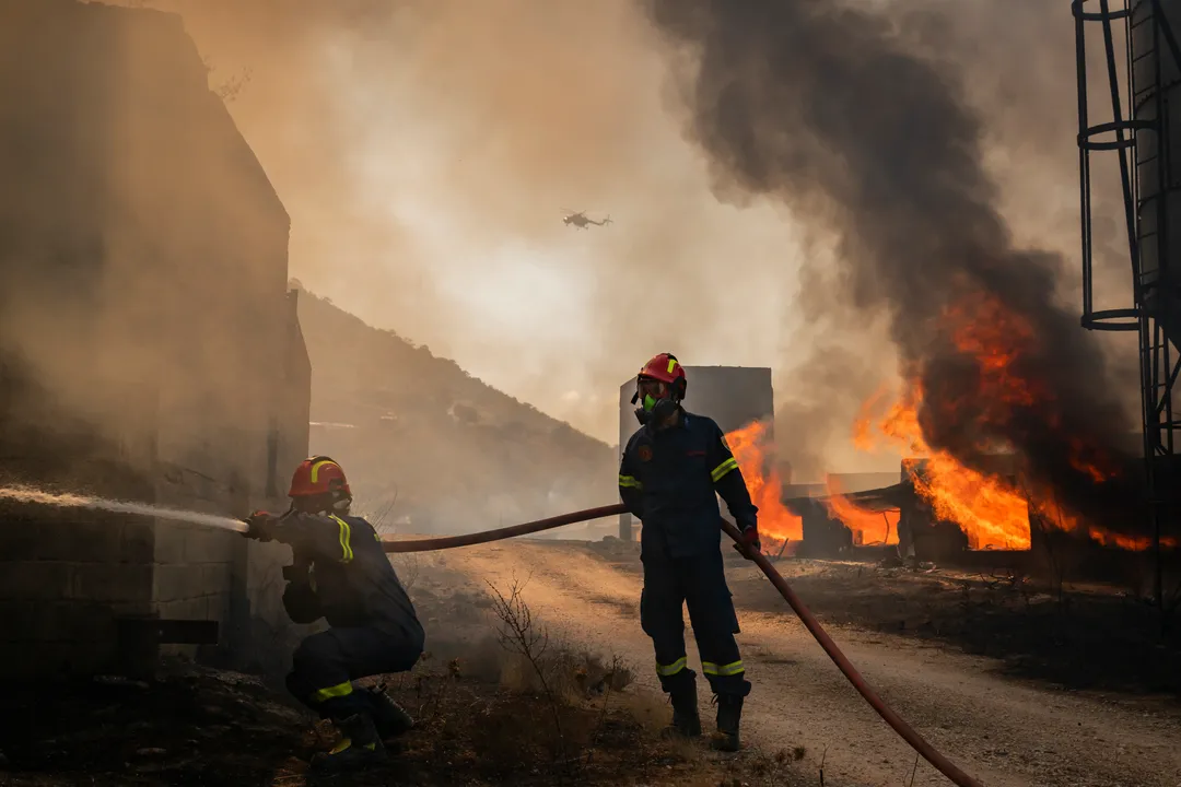 Strong winds fuel new wildfire near Athens, evacuation ordered