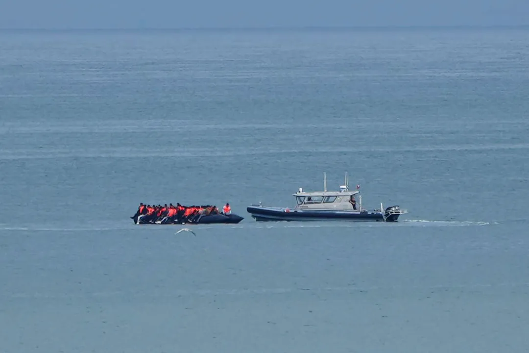 Small boat carrying record 230 migrants crosses English Channel to UK
