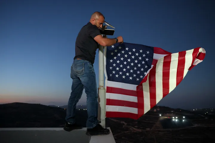Palestinian-American raises US flag over home besieged by illegal Israeli settlers