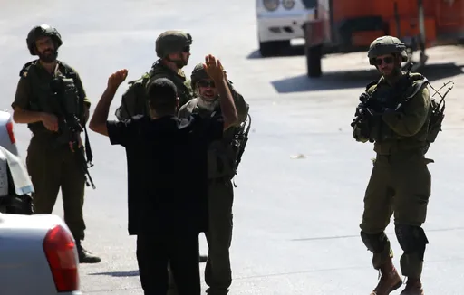 Israeli troops protect illegal settlers as siege of Palestinian homes enters day 12
