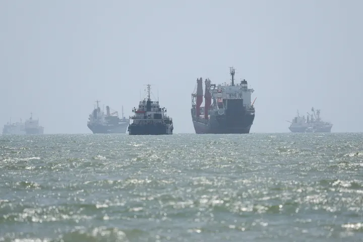 Iran agrees on temporary 7-mile Hormuz transit route with Oman, denies Strait is reopening