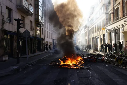 Paris erupts again as police clash with protesters and new looting hits France