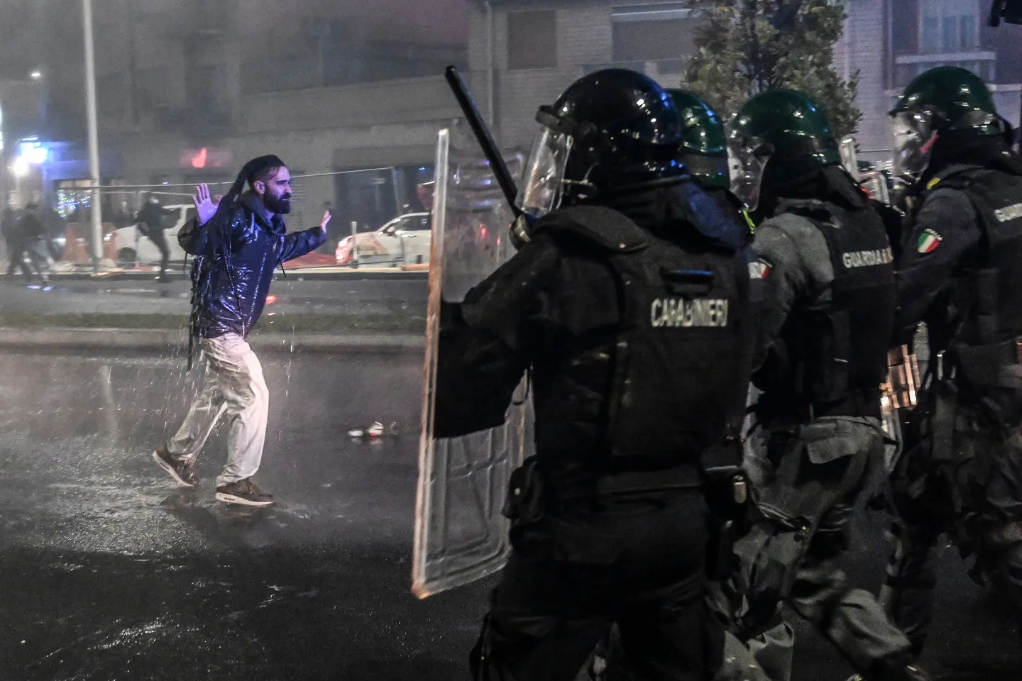 Police confront protesters as unrest flares in Italy and Spain