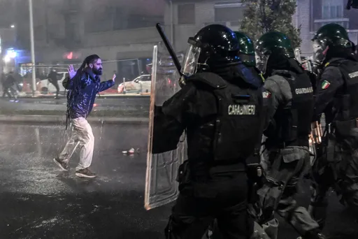 Police confront protesters as unrest flares in Italy and Spain