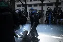 French unions call for fresh protests after more than 1,300 arrests during rallies over living costs