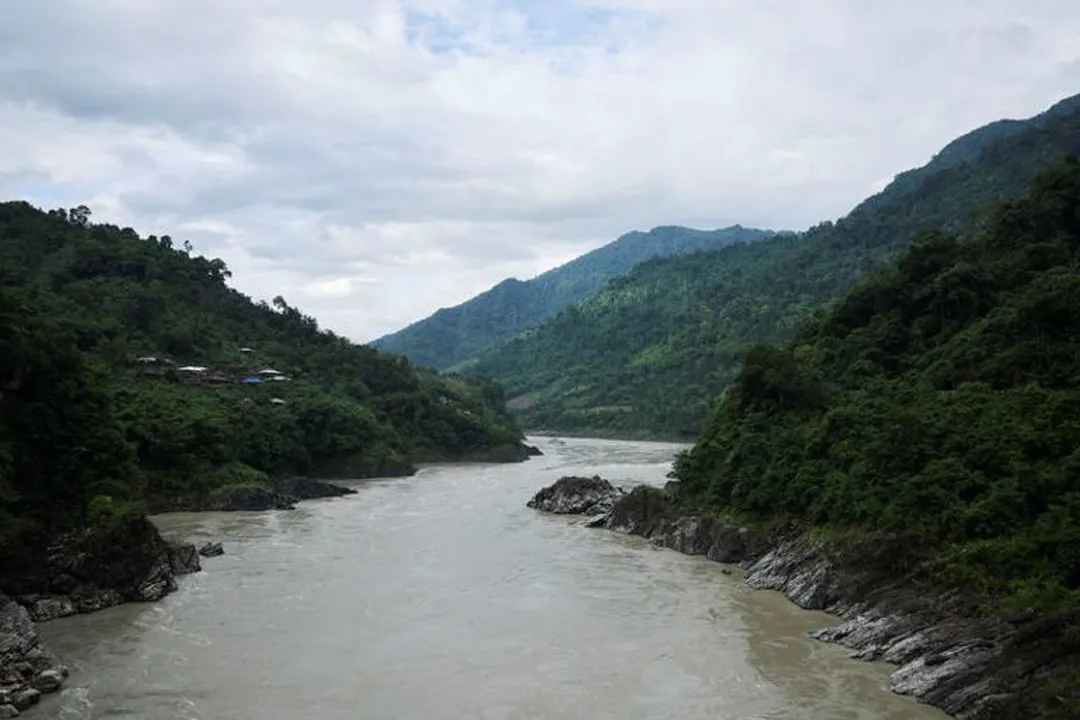 Why is India's dam project near China border facing local opposition?