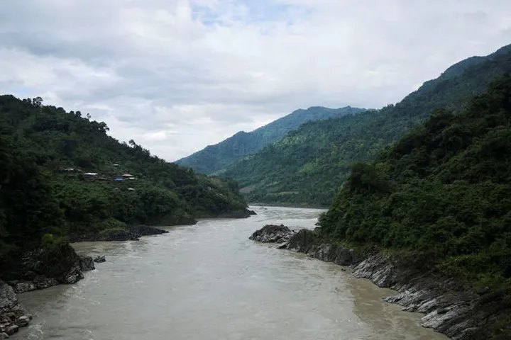 Why is India's dam project near China border facing local opposition?