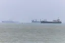 Cargo ship in Hormuz reports strike amid conflicting claims over US-Iran talks