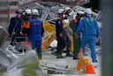 Japan earthquake death toll rises to 30 as rescuers race to find survivors at collapsed mall